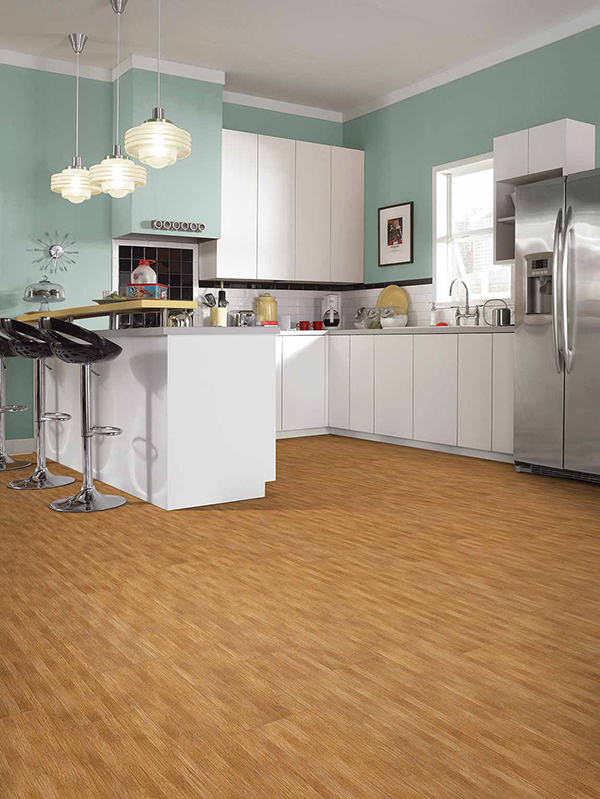 Modern 2020 themed kitchen that incorporates contrast between the turquoise green walls, white cabinets, and wood floor look.